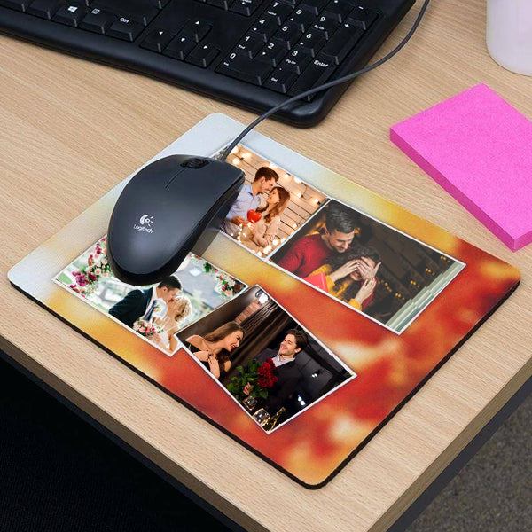 A personalized photo mouse pad with multiple images of people, placed on a desk with a keyboard and a pink notepad.